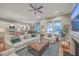 Spacious living room with an open layout to the kitchen, fireplace, and plush seating at 3713 Maidstone Dr, Mount Pleasant, SC 29466