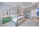 Well-lit main bedroom featuring a four-poster bed, bedside tables, and comfortable seating at 3713 Maidstone Dr, Mount Pleasant, SC 29466