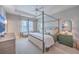 Spacious main bedroom with four poster bed, bedside tables, tv, and trey ceiling at 3713 Maidstone Dr, Mount Pleasant, SC 29466