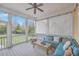 Cozy screened-in porch features comfortable seating and a view of the backyard at 3713 Maidstone Dr, Mount Pleasant, SC 29466