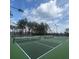 Well-maintained tennis courts surrounded by trees under a blue sky with fluffy clouds at 3713 Maidstone Dr, Mount Pleasant, SC 29466