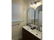 Modern bathroom featuring a double sink vanity with black arched mirrors and stylish lighting fixture at 5110 Temple St, North Charleston, SC 29405
