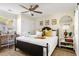 Inviting bedroom with queen bed, ceiling fan, desk, and ample storage space, perfect for relaxation at 5110 Temple St, North Charleston, SC 29405