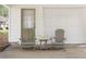 Relaxing covered patio with comfortable seating and refreshing drinks next to the door and garage at 5110 Temple St, North Charleston, SC 29405