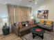 Cozy living room featuring stylish furniture, neutral color palette, and plenty of natural light at 5110 Temple St, North Charleston, SC 29405
