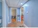 Hallway with hardwood floors and access to different rooms in the house at 635 Sequoia St, Charleston, SC 29407