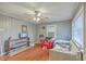 Living room featuring a ceiling fan, hardwood floors, and bright windows at 635 Sequoia St, Charleston, SC 29407