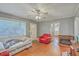 Inviting living room with hardwood floors, a ceiling fan, and a cozy fireplace at 635 Sequoia St, Charleston, SC 29407