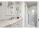Elegant bathroom with marble countertop, updated fixtures, and glass-enclosed shower at 67 Legare St # 305, Charleston, SC 29401