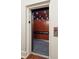 Elevator featuring wood-paneled interior, a black handrail, and recessed lighting at 67 Legare St # 305, Charleston, SC 29401
