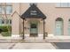 Charming building entrance with Crafts House sign and well-maintained landscaping at 67 Legare St # 305, Charleston, SC 29401