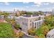Beautiful building featuring multiple balconies and windows, surrounded by lush trees and city views at 67 Legare St # 305, Charleston, SC 29401