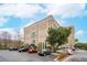 Exterior view of building with parking and blue sky at 67 Legare St # 305, Charleston, SC 29401