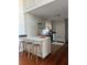 A marble island with seating is the perfect place to enjoy a bite in the kitchen at 67 Legare St # 305, Charleston, SC 29401