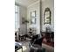 A cozy chair in this bright living room has a view of classic décor at 67 Legare St # 305, Charleston, SC 29401