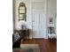 A cozy chair in this bright living room has a view of classic décor at 67 Legare St # 305, Charleston, SC 29401