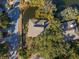 Aerial view of a house with pond, set amid lush trees at 796 Summerwind Cir, Edisto Beach, SC 29438