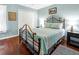 Cozy bedroom with a metal frame bed, closet, and dual nightstands at 796 Summerwind Cir, Edisto Beach, SC 29438