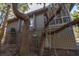 Charming home with traditional siding, lattice foundation, surrounded by trees at 796 Summerwind Cir, Edisto Beach, SC 29438
