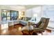 Comfortable living room featuring hardwood floors, a plush sectional, and a screened-in porch at 796 Summerwind Cir, Edisto Beach, SC 29438