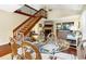 Bright living room with vaulted ceilings, a fireplace, and a wooden staircase at 796 Summerwind Cir, Edisto Beach, SC 29438