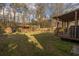 Spacious backyard with a covered patio, shed, and wooden shed for outdoor living at 8020 Nantuckett Ave, North Charleston, SC 29420