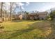 Large backyard, a covered patio, and a wooden fence offer privacy for outdoor enjoyment at 8020 Nantuckett Ave, North Charleston, SC 29420