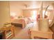 Charming bedroom with two twin beds, soft pink linens, and a cozy, inviting atmosphere at 8020 Nantuckett Ave, North Charleston, SC 29420