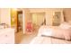 Bright bedroom featuring dual beds, connecting bath, and an adorable pink Christmas tree adding cheer at 8020 Nantuckett Ave, North Charleston, SC 29420