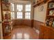 Bright bonus room featuring wood-look floors, ample storage, and a bay window for added natural light at 8020 Nantuckett Ave, North Charleston, SC 29420