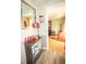 Inviting entryway with stylish decor, a charming mirror, and a glimpse into the comfortable living room space at 8020 Nantuckett Ave, North Charleston, SC 29420