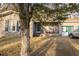 Well-maintained single-story home with brick facade, inviting front porch, and lush front yard at 8020 Nantuckett Ave, North Charleston, SC 29420
