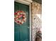 Charming front door with a wreath, creating a warm welcome to this inviting home at 8020 Nantuckett Ave, North Charleston, SC 29420