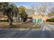 Cozy single-Gathering home with palm tree, long driveway, and attached garage at 8020 Nantuckett Ave, North Charleston, SC 29420