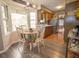 Eat-in kitchen featuring stainless steel appliances, wood cabinets, a bay window, and wood-look floors at 8020 Nantuckett Ave, North Charleston, SC 29420