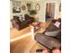 Living room featuring brown sofas, nautical decor, wood floors and a bright, airy ambiance at 8020 Nantuckett Ave, North Charleston, SC 29420