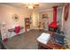 Comfortable living room features a decorative fireplace, keyboard, and a ceiling fan at 8020 Nantuckett Ave, North Charleston, SC 29420