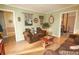 Inviting living room featuring comfortable brown sofas, nautical decor, and neutral wall colors at 8020 Nantuckett Ave, North Charleston, SC 29420