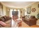 Comfortable living room featuring brown sofas, nautical decor, and a bright, airy ambiance at 8020 Nantuckett Ave, North Charleston, SC 29420