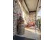 Inviting front porch with a chair and tree, offering a relaxing outdoor space at 8020 Nantuckett Ave, North Charleston, SC 29420