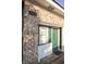 Side entrance features brick facade and contrasting green door, adding curb appeal at 8020 Nantuckett Ave, North Charleston, SC 29420