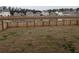 This backyard features a wood fence and a pond view at 911 Woodside Creek Ln, Summerville, SC 29486