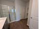 This bathroom showcases a glass-enclosed shower and access to a walk-in closet at 911 Woodside Creek Ln, Summerville, SC 29486