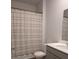 Bathroom featuring a neutral shower curtain, gray vanity, sink, and mirror at 911 Woodside Creek Ln, Summerville, SC 29486