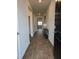 Inviting entry hallway featuring hardwood floors, neutral paint, and classic design at 911 Woodside Creek Ln, Summerville, SC 29486