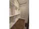 This walk-in closet features built-in shelving and hardwood flooring at 911 Woodside Creek Ln, Summerville, SC 29486