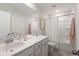 Bright bathroom boasts a spacious vanity, a large mirror, and a shower-tub combination at 116 Snow St, Summerville, SC 29486