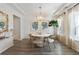 Open dining room with modern lighting, shiplap walls, and a cozy ambiance at 116 Snow St, Summerville, SC 29486