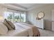 This spacious bedroom features a tray ceiling, large windows, and a light color palette at 116 Snow St, Summerville, SC 29486