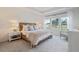 This main bedroom offers a comfortable bed and natural light from the large windows at 116 Snow St, Summerville, SC 29486